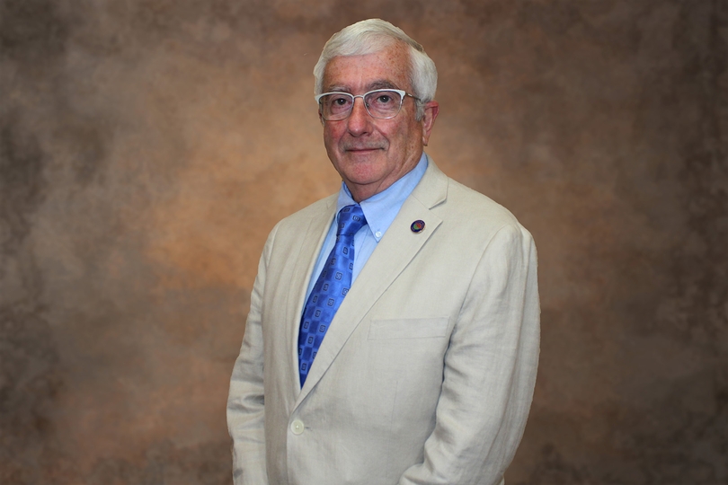 Paul Rose in a Cream Suit Jacket